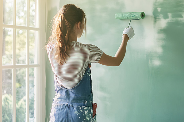 DIYers painting a home interior