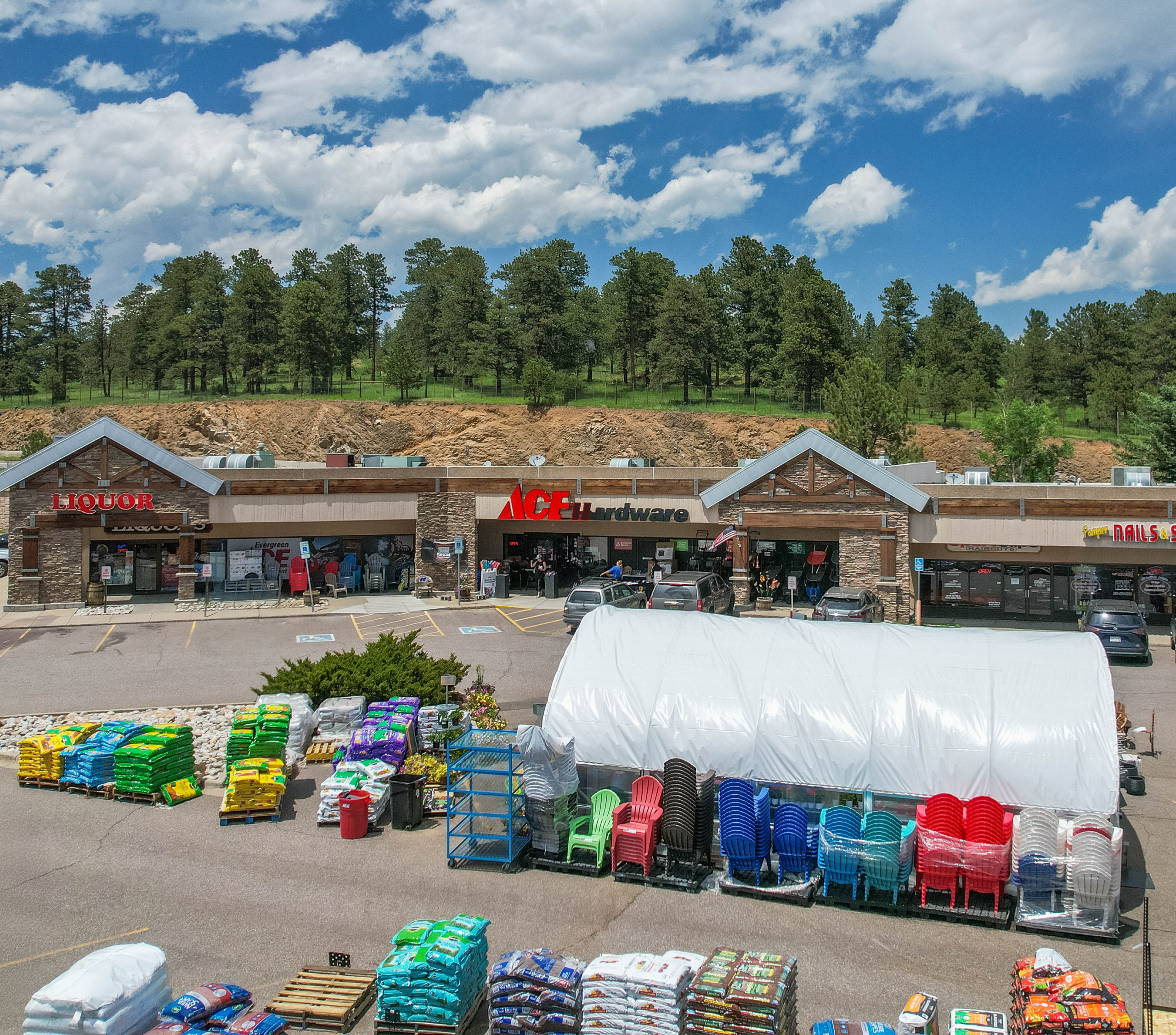 Aerial view of Moore Lumber Ace Hardware storefront in Evergreen, Colorado with garden center display